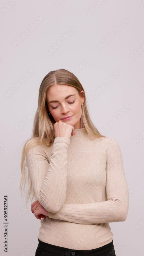 video portrait of young woman thinking and wonder standing on white background, pensive and expressions video portrait of young woman thinking and wonder standing on white background, pensive and expressions