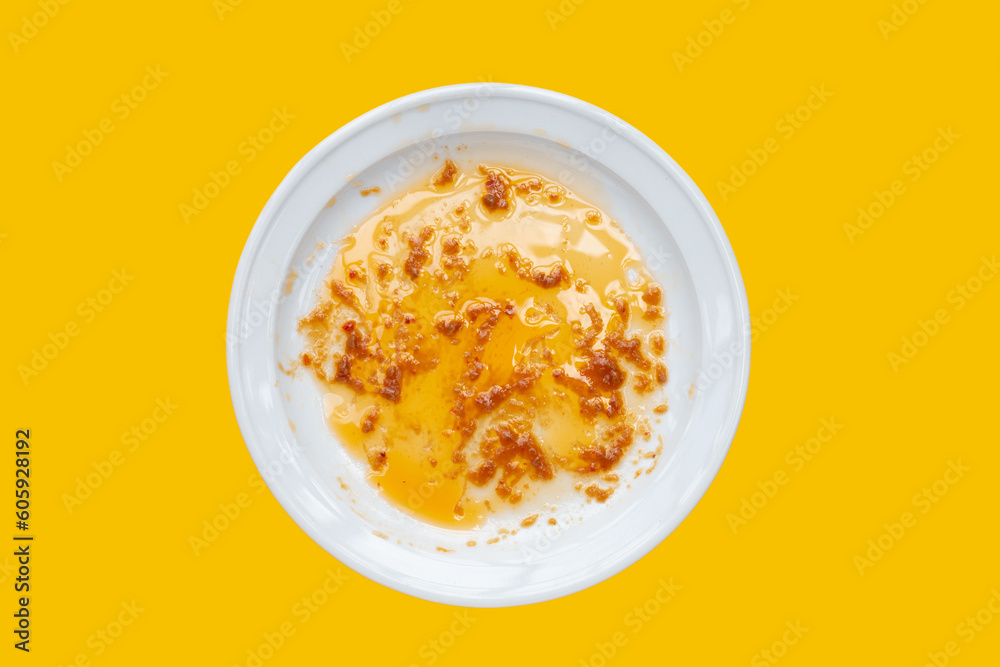Dirty dish on yellow background. Top view Dirty dish on yellow background. Top view