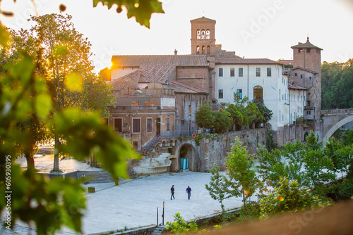  Isola Tiberina or Isola Tiberina in Rome.Italy. Isola dei Due Ponti, Licaonia, San Bartolomeo Island at sunset. An ancient river island of the Tiber with historical monuments, center of Rome. photo