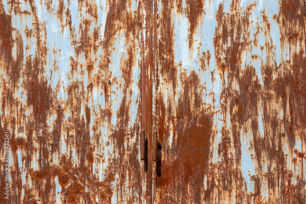 close-up view of an old rusted metal door