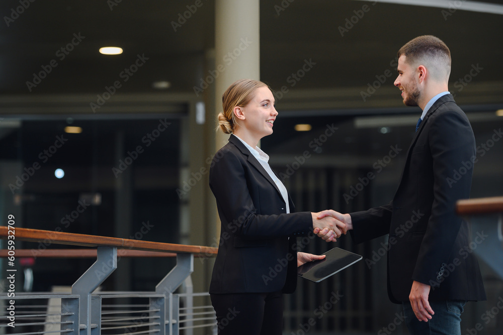 Portrait of Happy smiling business woman handshake with business man Business mergers and acquisitions image of business people handshake to teamwork Portrait of Happy smiling business woman handshake with business man Business mergers and acquisitions image of business people handshake to teamwork