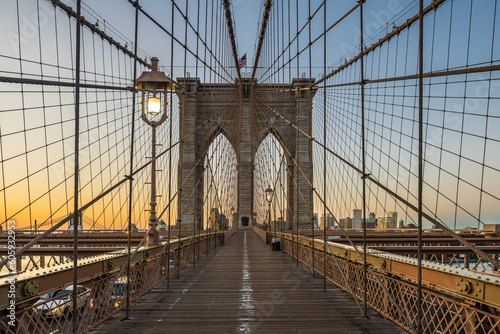 The Brooklyn bridge and lighting lamps early in the morning dawn. © Ondrej Bucek