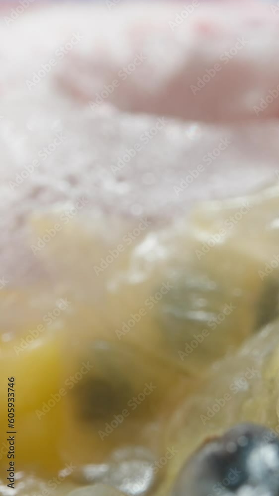 Half a passion fruit with seeds. View from inside. Dolly. Vertical, Social Media. Half a passion fruit with seeds. View from inside. Dolly. Vertical, Social Media.