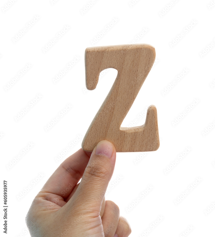 Hand holding wooden letter Z Hand holding wooden letter Z