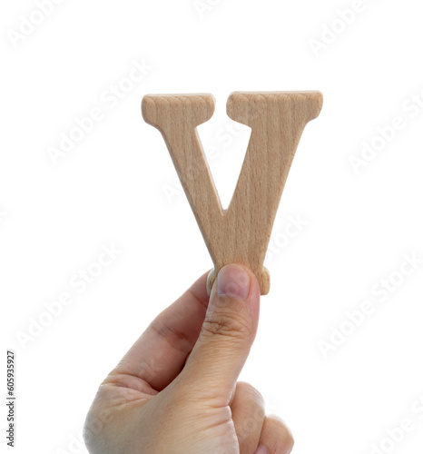 Hand holding wooden letter V