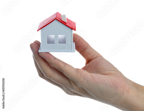 Human hand holding model house