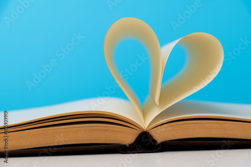 Book pages curved into heart shape