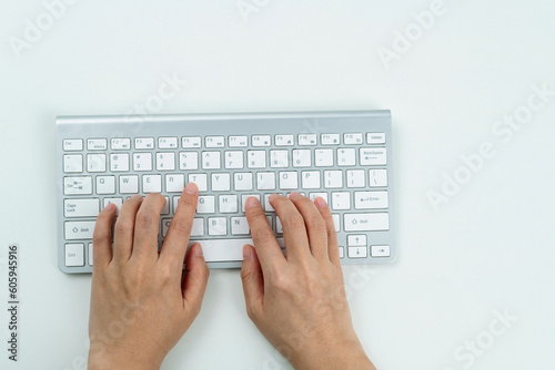 Woman hand tying on wireless keyboard