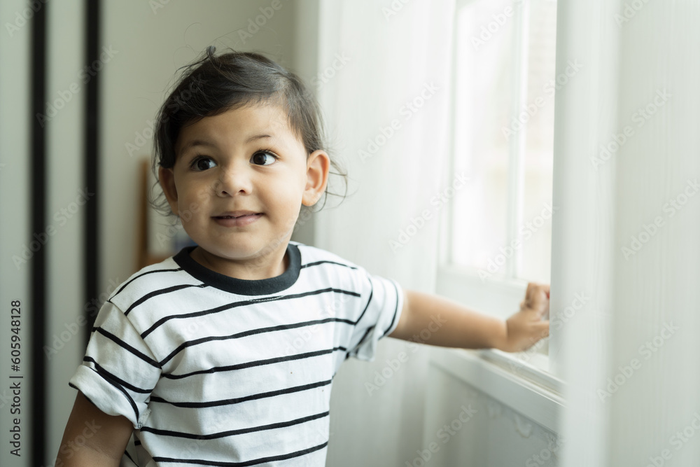 Happy smiling cute little toddler boy playing in living room at home Happy smiling cute little toddler boy playing in living room at home