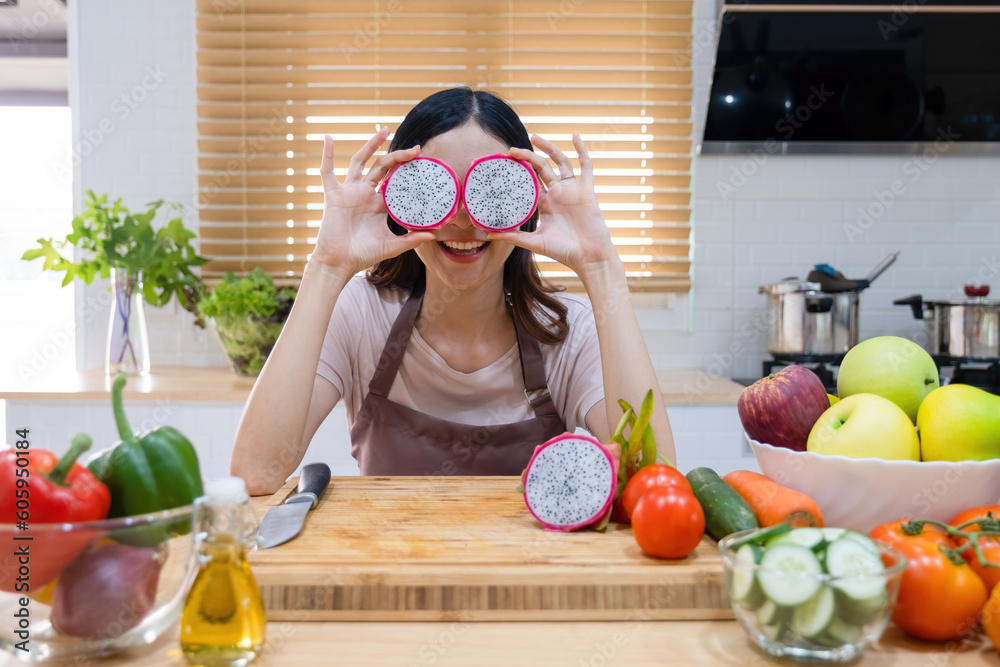 Woman holding and showing cut fruits. Woman holding and showing cut fruits.