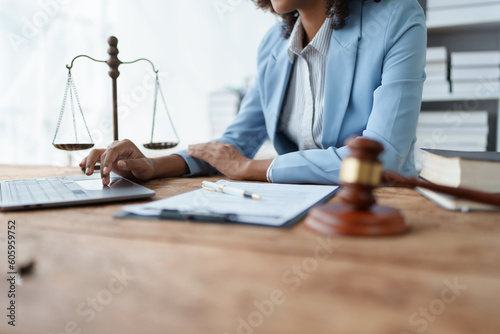 A young women African American lawyer lawsuit studying cases for clients in a law firm to fight against their parties in the courts. law and attorney concepts.