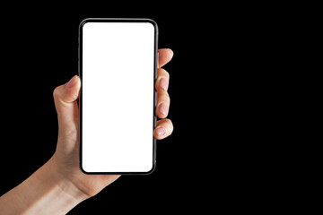 phone in hand on a black background