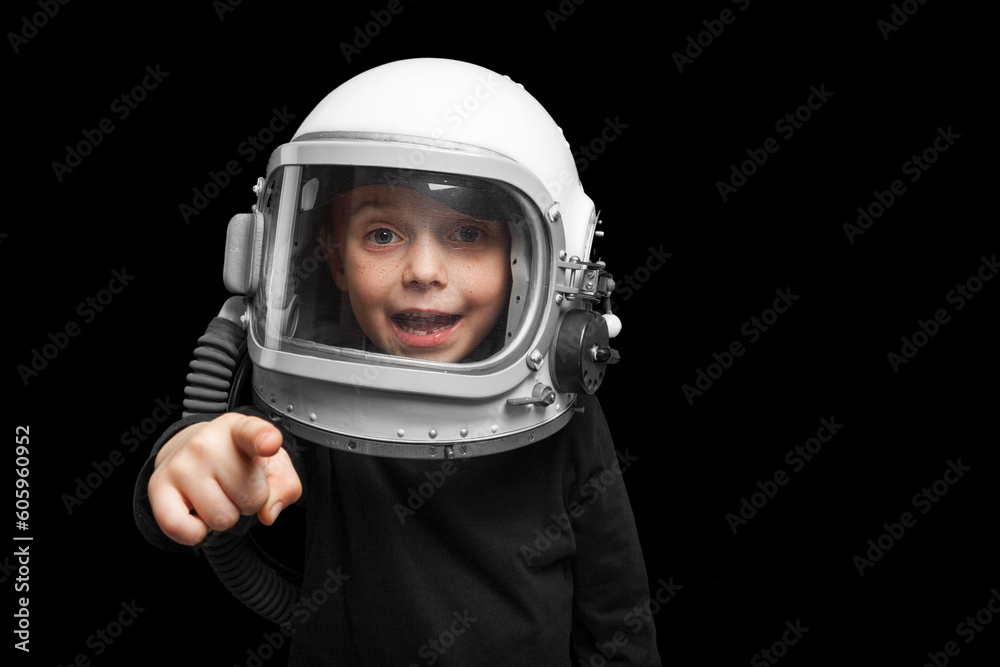 Small child wants to fly an in space wearing an astronaut helmet. Small child wants to fly an in space wearing an astronaut helmet.