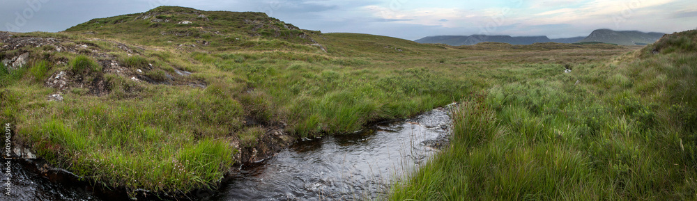 Heather and peat fields. Connamara Westcoast Ireland. Littel streaming brook. Babbling stream. Panorama. Heather and peat fields. Connamara Westcoast Ireland. Littel streaming brook. Babbling stream. Panorama.