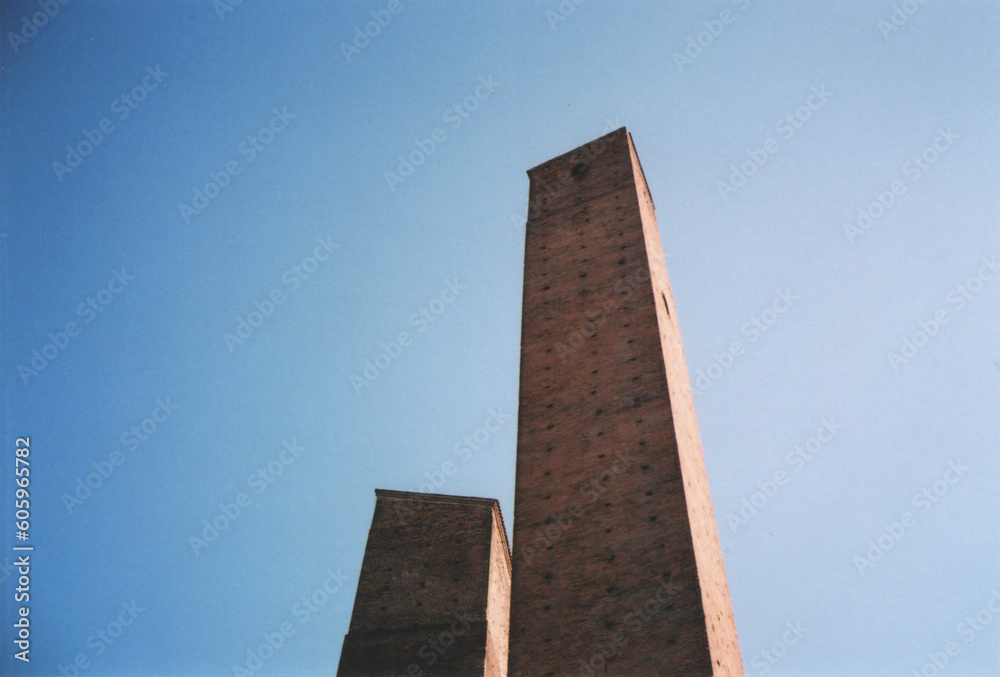 Ancient Medieval Towers View from Below with Blue Sky. Pavia City Center, Italy. FIlm Photography Ancient Medieval Towers View from Below with Blue Sky. Pavia City Center, Italy. FIlm Photography