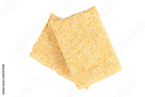 Two pieces of Indian mithai (dessert), delicate, soft, crunchy Gajak Bar made of Til, Desi Ghee, and Jaggery.  Top view. photo