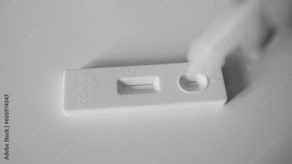 A patient with Covid-19 did an express test at home, the result is positive. Covid-19 test kit for detecting IgM IgG antibodies and immunity in 15 minutes. High quality FullHD footage A patient with Covid-19 did an express test at home, the result is positive. Covid-19 test kit for detecting IgM IgG antibodies and immunity in 15 minutes. High quality FullHD footage