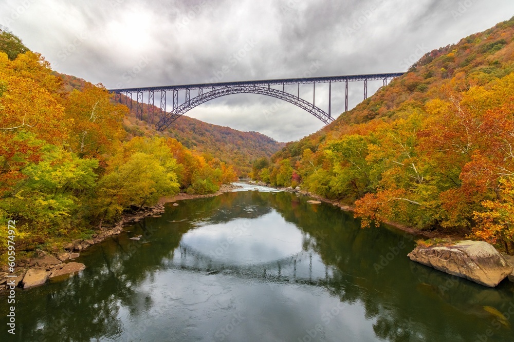 Aerial view of a colorful autumn landscape with a bridge in New River Gorge National Park