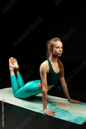 fitness and yoga girl on a black background