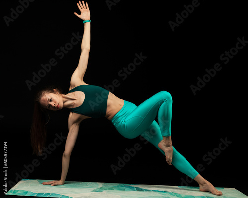 fitness and yoga girl on a black background