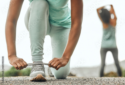Fotografi Shoes, sports and a woman runner tying laces outdoor during an exercise workout for endurance or cardio
