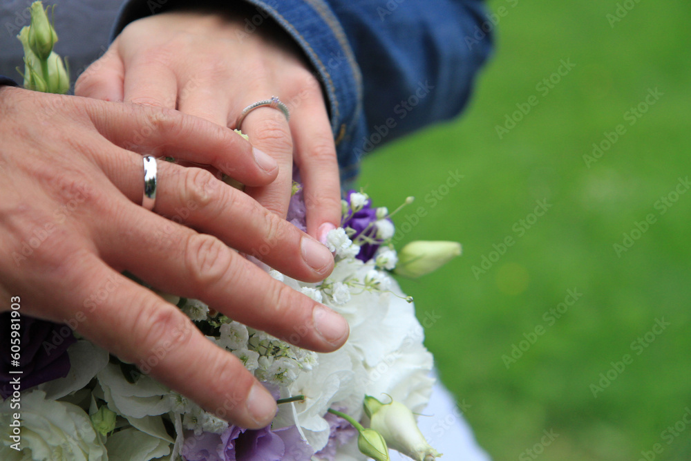 Fototapeta premium wedding rings on the human hands