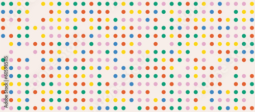 Festive abstract dotted background in rainbow colors. Cute colorful polka dots pattern. Circles confetti on beige background. Retro horizontal backdrop