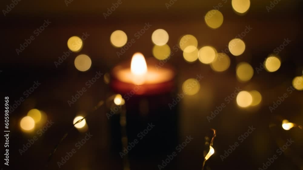 Beautiful blurred background of a candle with Christmas bokeh lights Beautiful blurred background of a candle with Christmas bokeh lights