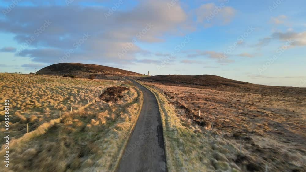 Road to Tiumpan Head Lighthouse at Sunrise isle of Lewis, Scotland Aerial View Road to Tiumpan Head Lighthouse at Sunrise isle of Lewis, Scotland Aerial View