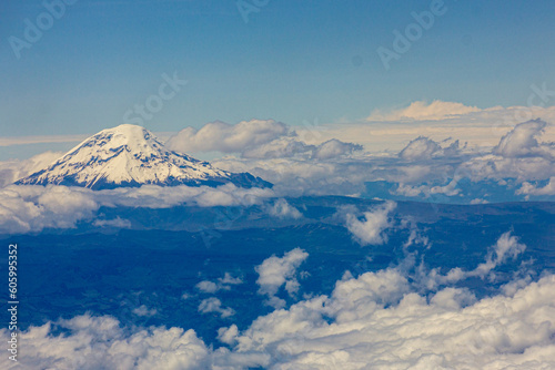Snowy peak of Chimborazo, the tallest volcano in Ecuador, in clouds, from the air