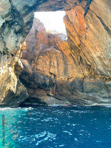 tourist attraction explore grottoes, cave with hole at top, mediterranean sea, clear turquoise water, adventure, exploration under water caves, active sport, wonderful vacation, lack drinking water