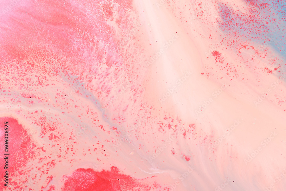 Multicolored creative abstract background. Red pink alcohol ink. Waves, stains, spots and strokes of paint, marble texture