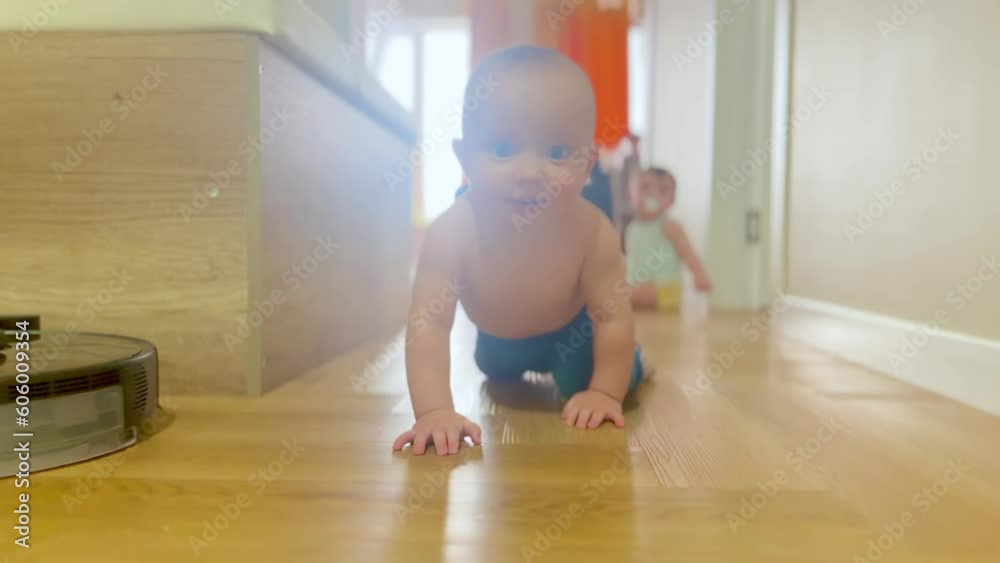 baby crawling on the floor twins play having fun. happy family child dream concept. baby boy fun crawling on the floor in the hallway first steps. baby twins crawls plays at home lifestyle baby crawling on the floor twins play having fun. happy family child dream concept. baby boy fun crawling on the floor in the hallway first steps. baby twins crawls plays at home lifestyle