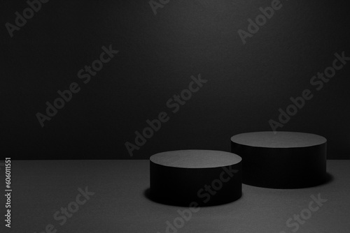 Abstract black stage with two round podiums in light beam with light spot mockup for presentation cosmetic products, goods, advertising, design, showing with soft gradient in beauty fashion style.