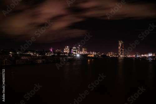 Scenic view of a coastal city skyline during nightime © Luca Van Belle/Wirestock Creators