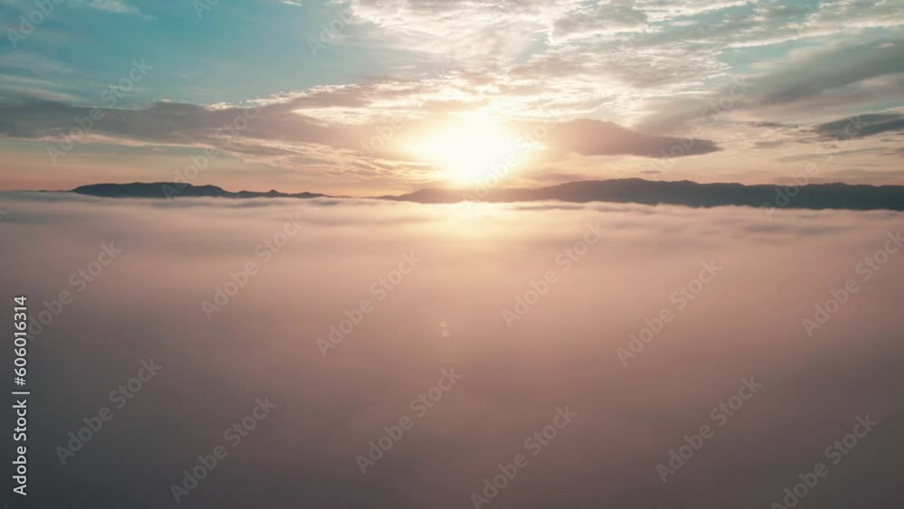 Beautiful scene over sea water with a colorful sunset sky and silhouette mountains Beautiful scene over sea water with a colorful sunset sky and silhouette mountains