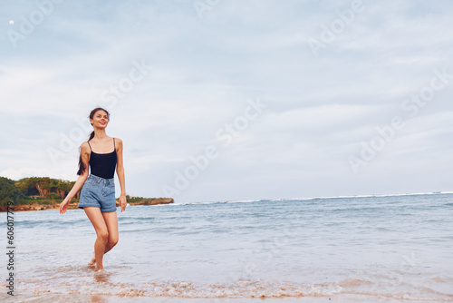 lifestyle woman beach happy smile travel running young summer sea sunset