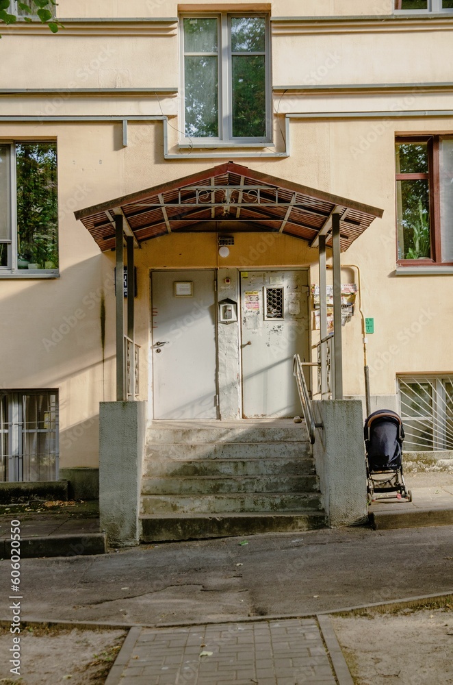Entrance of an old cream residential building, Belarus, Minsk