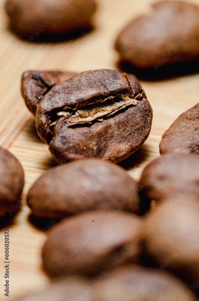 Beautiful closeup of coffee beans on wooden background Beautiful closeup of coffee beans on wooden background