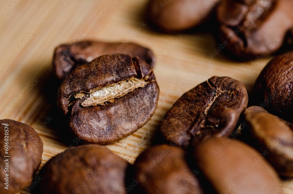 Beautiful closeup of coffee beans on wooden background Beautiful closeup of coffee beans on wooden background