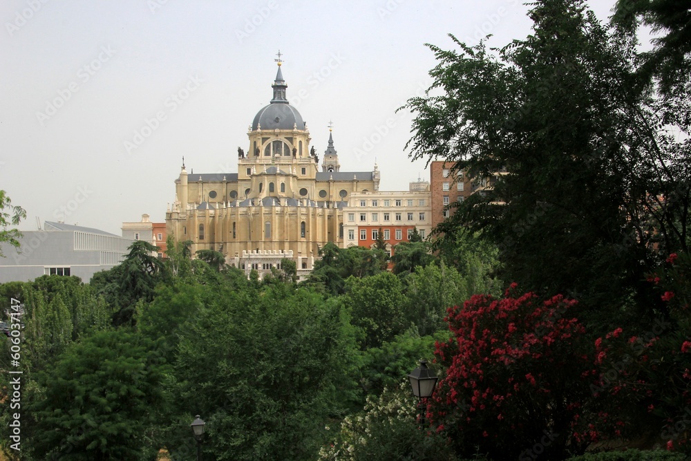 Madrid, Spain - June 16, 2022: Royal Palace in Madrid with green trees foreground