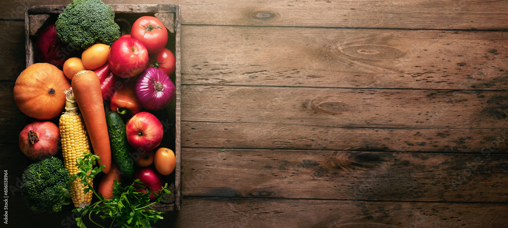 Fruit harvest in a wooden box on an empty table, top view, rustic style Fruit harvest in a wooden box on an empty table, top view, rustic style