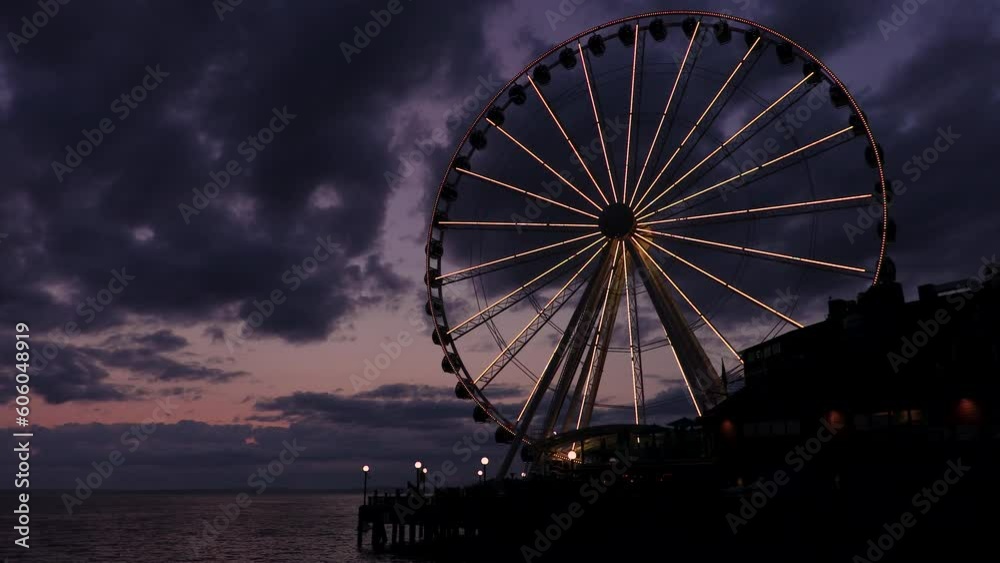 Timelapse or time lapse of The Great Wheel at sunset, Pier 57, Seattle, Washington, USA