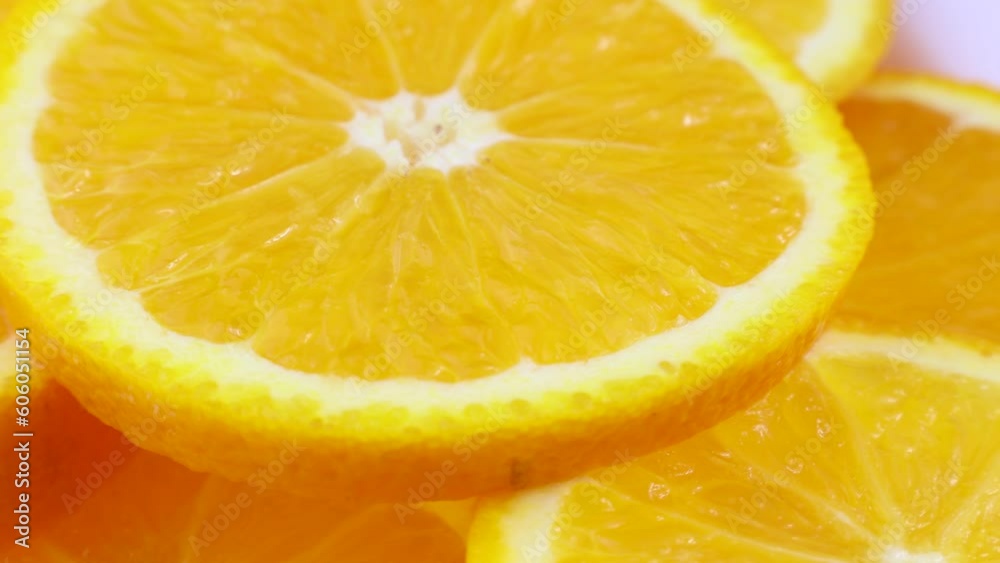 Bright yellow orange slices rotation close up