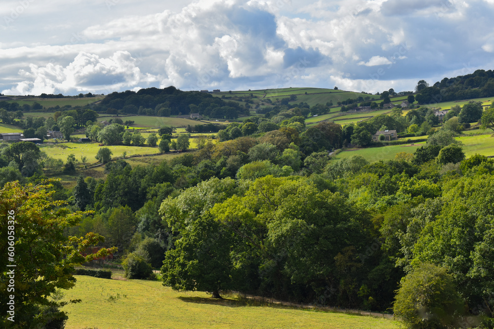 Landscape green countryside farm hills with green trees and blue skies Landscape green countryside farm hills with green trees and blue skies