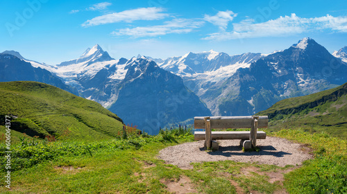 wooden bench with stunning view to Bernese Alps Grindelwald