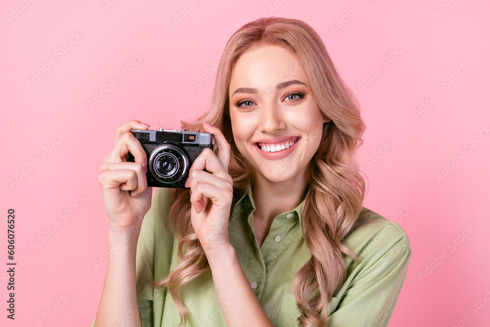 Photo of cheerful adorable woman dressed green shirt tacking photo vintage camera isolated pink color background Photo of cheerful adorable woman dressed green shirt tacking photo vintage camera isolated pink color background