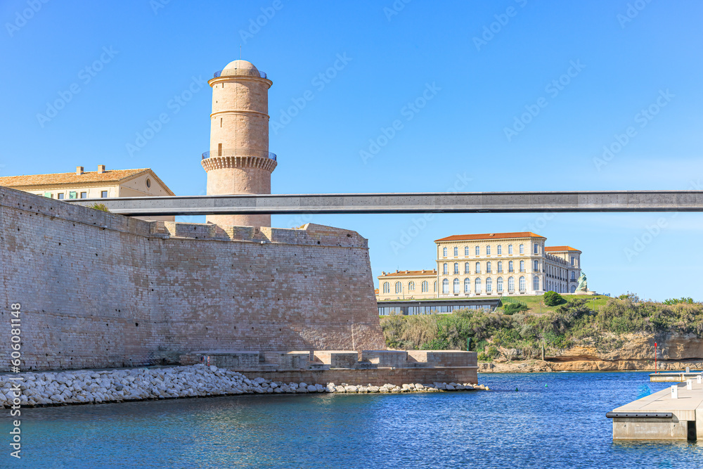 A scenics view of the tower and walking bridge of theMucem (Museum of European and Mediterranean Civilisations) in Marseille, bouches-du-rhône, France under a majestic blue sky and some white clouds