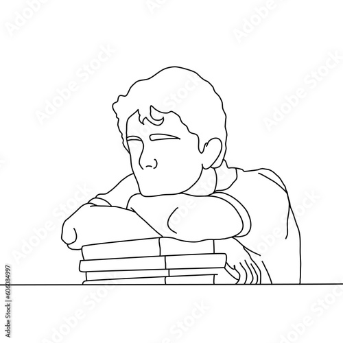 a man lies on a table leaning on books