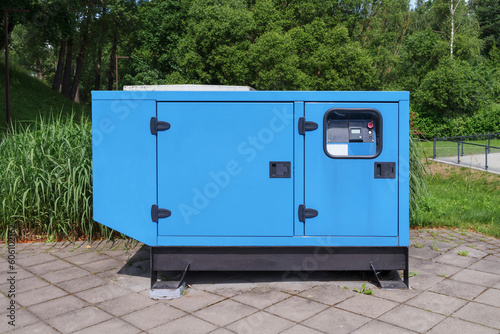 Electricity generator. Large, powerful blue stationary generator for electricity production
